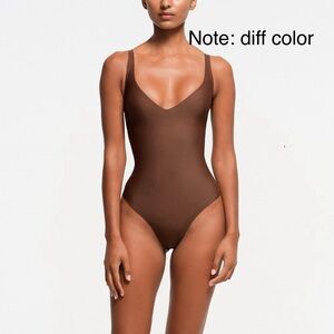 Skims bronze naked plunge thong body suit size medium never worn